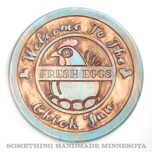 The Chick Inn sign with fresh eggs in teal